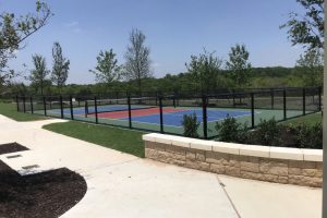 Chain LInk fence black tennis court sidewalk