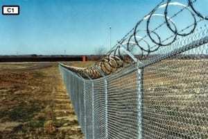 Chain link fence with razor wire c 1