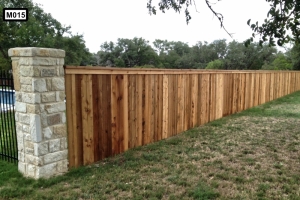 Ceader wooden fence with stone piliars M015