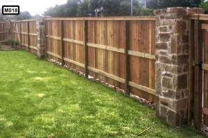 Wooden fence back with stone piliars- M018