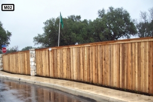 Stone pillars on  wooden fence- M02