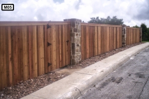 Stone pillars on wooden fence- M05 Stone pillars on wooden fence- M05