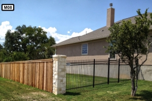 Stone piliar on both wooden and metal fence- M08