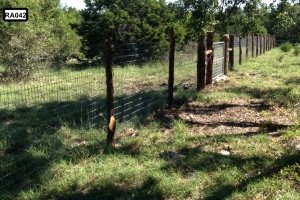 long fence line with wooden posts - RA042