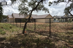 long black metal fence with 2x4 fencing- RA050