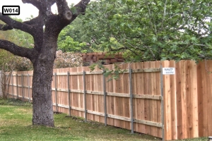 1x6x6 ft Dog-Ear Western Red Cedar Fence on metal post in backyard with tree