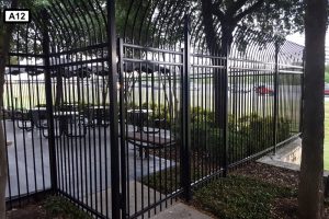 Ameristar Montage Commercial Invincible 3 Rail Fence and Gate in Black Around Patio