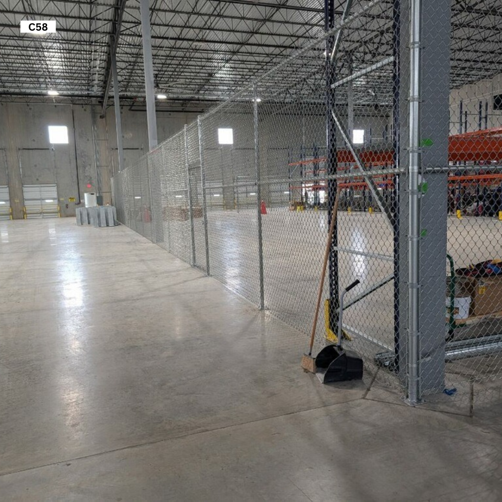 8’ Tall Commercial grade 9 gauge Chain Link bolted down to concrete with Base Plates with Wedge Anchors