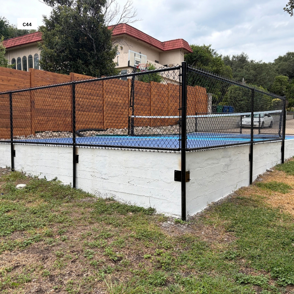 6’ Tall Ameristar 3 rail with 2”x 2” post mounted to concrete with a 4”x 4” Base Plate with ADA Free Exit push bar with Expanded metal powder coated Black