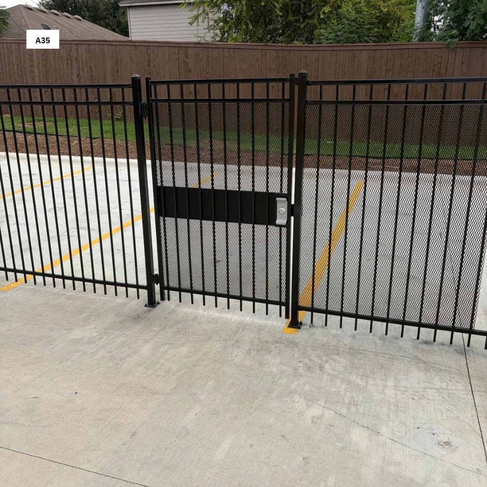 Ameristar 3 rail 6’ Tall Ameristar 3 rail with 2”x 2” post mounted to concrete with a 4”x 4” Base Plate with ADA Free Exit push bar with Expanded metal powder coated Black
